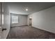 Spacious, carpeted bedroom featuring natural light and closet access for ample storage at 2325 Mountain Sky Dr, Fort Lupton, CO 80621