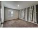 bedroom with whimsical forest mural, window with blinds, plush carpet, adding character and charm to the space at 2325 Mountain Sky Dr, Fort Lupton, CO 80621