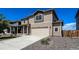 Well-maintained two-story home with a two-car garage and an inviting front entrance at 2325 Mountain Sky Dr, Fort Lupton, CO 80621