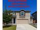 Inviting two-story home featuring a neutral color scheme, well-maintained lawn, and a two-car garage at 2325 Mountain Sky Dr, Fort Lupton, CO 80621