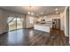 Bright kitchen featuring an island, granite countertops, stainless steel appliances, and access to the backyard at 2325 Mountain Sky Dr, Fort Lupton, CO 80621