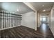 Bright living room with unique accent wall and dark, modern floors at 2325 Mountain Sky Dr, Fort Lupton, CO 80621