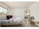 Charming bedroom with stylish decor, wood floors, and modern accents and lots of light at 16397 E Wyoming Dr, Aurora, CO 80017
