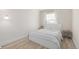 Inviting bedroom featuring a cozy bed, soft lighting, and clean, minimalist design at 16397 E Wyoming Dr, Aurora, CO 80017
