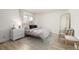 Cozy bedroom with stylish decor, wood floors, and modern accents and lots of light at 16397 E Wyoming Dr, Aurora, CO 80017