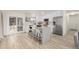 Modern kitchen with an island, stainless steel appliances, and a breakfast bar with seating at 16397 E Wyoming Dr, Aurora, CO 80017