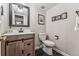 Stylish half bathroom with modern vanity, fixtures, and elegant decorative touches at 7250 Eastmoor Dr # 119, Denver, CO 80237