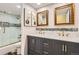Bathroom with double sinks, updated fixtures, and shower at 7250 Eastmoor Dr # 119, Denver, CO 80237