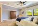 Comfortable bedroom with chair, wardrobe, and neutral decor at 7250 Eastmoor Dr # 119, Denver, CO 80237
