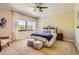 Bright bedroom with large windows, comfortable bed, and neutral decor at 7250 Eastmoor Dr # 119, Denver, CO 80237