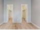 Bedroom area with large closets featuring neutral carpet, and light paint at 7250 Eastmoor Dr # 119, Denver, CO 80237