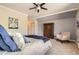 Comfortable bedroom with chair, wardrobe, and neutral decor at 7250 Eastmoor Dr # 119, Denver, CO 80237