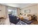 Inviting living room featuring hardwood floors, modern furniture, and a bright, airy atmosphere at 7250 Eastmoor Dr # 119, Denver, CO 80237