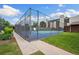Community tennis court with green and blue surface, surrounded by fencing and landscaping at 7250 Eastmoor Dr # 119, Denver, CO 80237