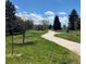 Winding walking path through a green space, perfect for a leisurely stroll surrounded by nature at 7250 Eastmoor Dr # 119, Denver, CO 80237