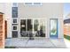 Modern back patio with outdoor seating, sliding glass doors, and a blue accent door at 3635 Osage St, Denver, CO 80211