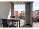 Cozy balcony space with a table and chairs, offering a view of the neighborhood at 3635 Osage St, Denver, CO 80211