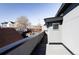 Exterior shot of a balcony overlooking rooftops in a neighborhood setting at 3635 Osage St, Denver, CO 80211