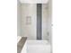Clean bathroom with a tiled shower featuring a built-in niche, a bathtub, and modern fixtures at 3635 Osage St, Denver, CO 80211