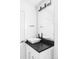 Modern bathroom featuring a vessel sink, sleek black countertop and oversized mirror at 3635 Osage St, Denver, CO 80211