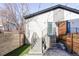Modern home exterior featuring a stylish stairway, fenced yard and contemporary design elements at 3635 Osage St, Denver, CO 80211