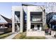 Striking modern home showcasing balconies and architectural details with distinct entrances at 3635 Osage St, Denver, CO 80211