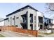 Modern two-story house with balconies, clean lines, and a minimalist facade at 3635 Osage St, Denver, CO 80211