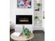 Close-up of the living room fireplace and shelving, styled with neutral vases and plants at 3635 Osage St, Denver, CO 80211