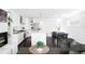 Open-concept living space with modern kitchen, dining area, and bright living room at 3635 Osage St, Denver, CO 80211