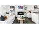 Open-concept living space with fireplace, built-in shelves, and seamless access to the kitchen at 3635 Osage St, Denver, CO 80211