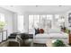 Bright living room with sliding doors, plush seating, and a relaxed modern design at 3635 Osage St, Denver, CO 80211