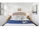 Cozy primary bedroom with a plush bed, soft lighting, and neutral décor at 3635 Osage St, Denver, CO 80211