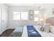 Bright bedroom features large windows, modern decor, and a comfortable sitting area at 3635 Osage St, Denver, CO 80211