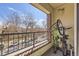 A balcony with a view of the street and a bicycle storage rack at 1623 Saint Paul St # 306, Denver, CO 80206