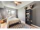 Cozy bedroom with carpeted floors, large windows, and modern accents at 1623 Saint Paul St # 306, Denver, CO 80206