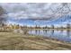 Scenic lake view with ducks, blue skies, and beautiful landscape with a building in the background at 1623 Saint Paul St # 306, Denver, CO 80206