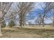 Expansive green space with mature trees near a serene lake, perfect for outdoor activities and relaxation at 1623 Saint Paul St # 306, Denver, CO 80206