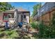 The backyard includes the home, privacy fence, and some patio furniture at 2234 W 35Th Ave, Denver, CO 80211