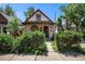 Charming home with beautiful landscaping and a quaint front porch at 2234 W 35Th Ave, Denver, CO 80211