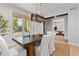 Elegant dining room with a contemporary chandelier and large window for natural light at 3256 S Corona, Englewood, CO 80113