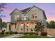Charming two-story home with a welcoming front porch and beautiful landscaping at 3256 S Corona, Englewood, CO 80113