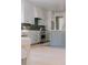 Bright kitchen featuring stainless steel appliances, modern finishes and large island at 3256 S Corona, Englewood, CO 80113