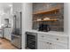 Gourmet kitchen featuring stainless steel refrigerator and built-in wine cooler at 3256 S Corona, Englewood, CO 80113