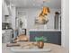The kitchen features an island with seating and stainless steel appliances at 3256 S Corona, Englewood, CO 80113