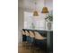 Chic kitchen island with seating, pendant lighting, and an inviting open concept design at 3256 S Corona, Englewood, CO 80113