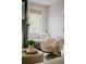 Comfortable armchair near window provides a cozy corner for reading and relaxation by the fireplace at 3256 S Corona, Englewood, CO 80113