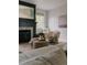 Comfortable armchair by a fireplace and window offers a cozy retreat in a modern living space at 3256 S Corona, Englewood, CO 80113