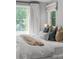 Bright main bedroom with large windows, plush bedding, and serene decor creates a peaceful retreat at 3256 S Corona, Englewood, CO 80113