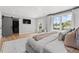 Spacious main bedroom has natural light, a walk-in closet, and modern decor for a comfortable and stylish living space at 3256 S Corona, Englewood, CO 80113