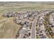 Panoramic community aerial with homes, winding streets, and natural landscapes at 13960 Box Turtle Loop, Parker, CO 80134